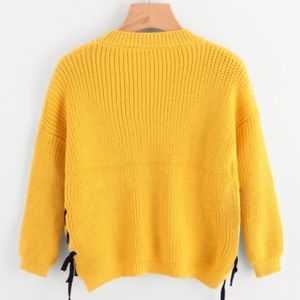 Yellow sweater with black accent on sides